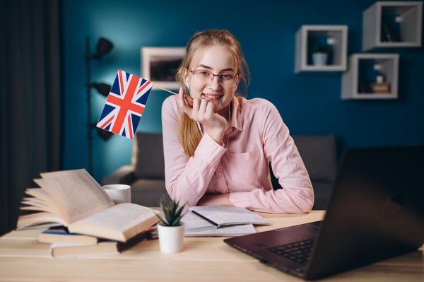 cute-ginger-girl-in-glasses-holding-a-british-flag.jpg